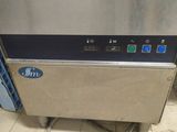 an image of a commercial ice maker in a kitchen