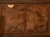a picture of an old wooden cabinet with a mirror on it