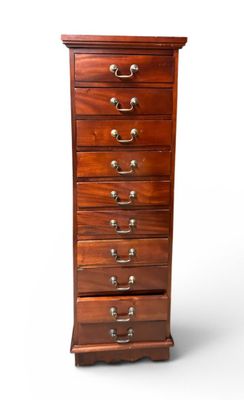 an image of a tall wooden chest of drawers on a white background
