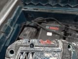 a drill that is sitting in a tool box