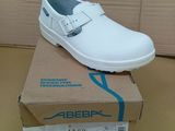 a white shoe that is on top of a box