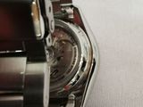 a close up of a watch on a person ' s wrist