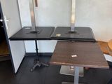 a table with two chairs and a table with a laptop on it