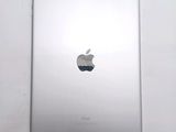 an apple ipad sitting on top of a white table next to a white wall