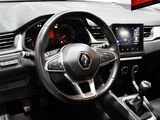 a steering wheel and dashboard of a car in a car showroom