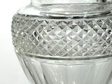 a clear glass vase with a decorative design on it
