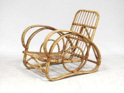 a wicker chair that is sitting on a white surface