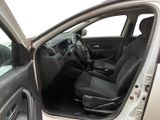 the interior of a car with the door open showing the driver ' s seat