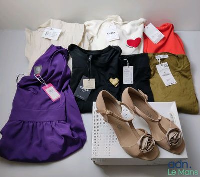 several pairs of women ' s shoes and a purse on a table