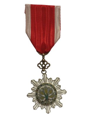 l'image d'une médaille surmontée d'une étoile