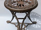 an image of a small table with a flower design on it