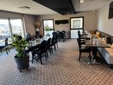 a large dining room with a lot of tables and chairs