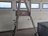 a ladder that is leaning against a wall in a garage