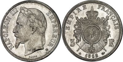 a close up of a coin with a crown on top of it
