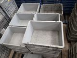 many plastic containers that are stacked on top of each other