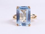 an image of a ring with a blue topaz stone