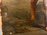 someone is holding a painting of a man in a bathing suit