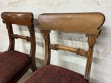 pair of antique wooden chairs with upholstered upholstered seats