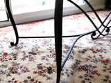 a cat that is sitting on a table in the living room