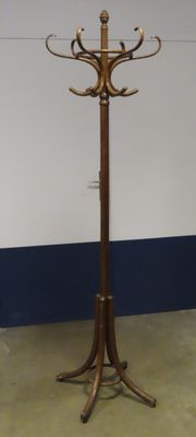 a coat stand with a coat rack in the middle of it