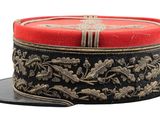 a red and black hat with gold designs on it