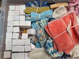 a plastic container filled with different types of fabric