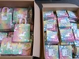 two boxes of soaps that are sitting on the floor
