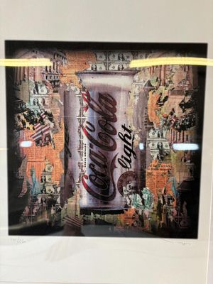 a picture of a coca cola can in a picture frame