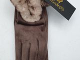 the gloves are brown with a fur collar and a black tag