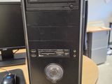 a desktop computer sitting on top of a wooden desk