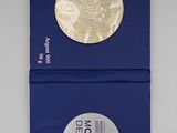 two blue boxes with a gold coin on top of them