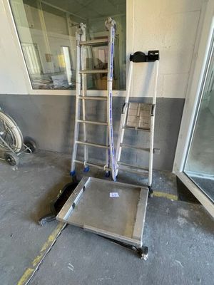 a ladder that is sitting in the middle of a room