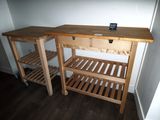 a wooden table with a cell phone on top of it