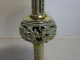 a gold lamp that is sitting on a table