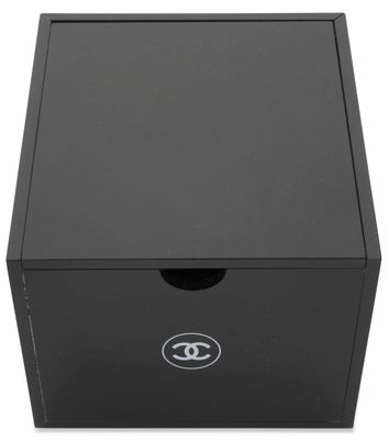 a black box with a logo on the lid