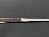 a knife that is sitting on top of a table