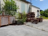 a lot of junk in front of a building on the street