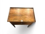 a small wooden table with a drawer on it
