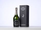 a bottle of champagne in front of a black box