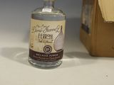 a bottle of liquor sitting next to a cardboard box