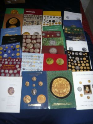 a lot of books on a table with a blue table cloth