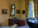 a room with a piano and a chair in it