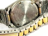 a close up of a wrist watch on a white surface