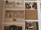many christmas cards laid out on a table