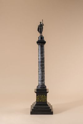 a statue of a man standing on top of a pedestal
