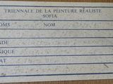 a picture of a sign on a table that says trienale de la penture realite