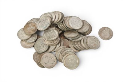 a pile of old coins on a white surface