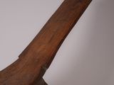 an old wooden bench sitting on top of a white surface