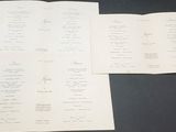 two papers that are sitting on top of a table