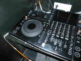 a black dj controller sitting on top of a table
